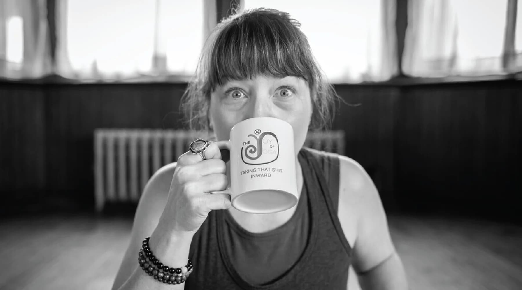 Black-and-white portrait of Christina Anne Willingham, Yoga Business Coach behind the joy of yoga