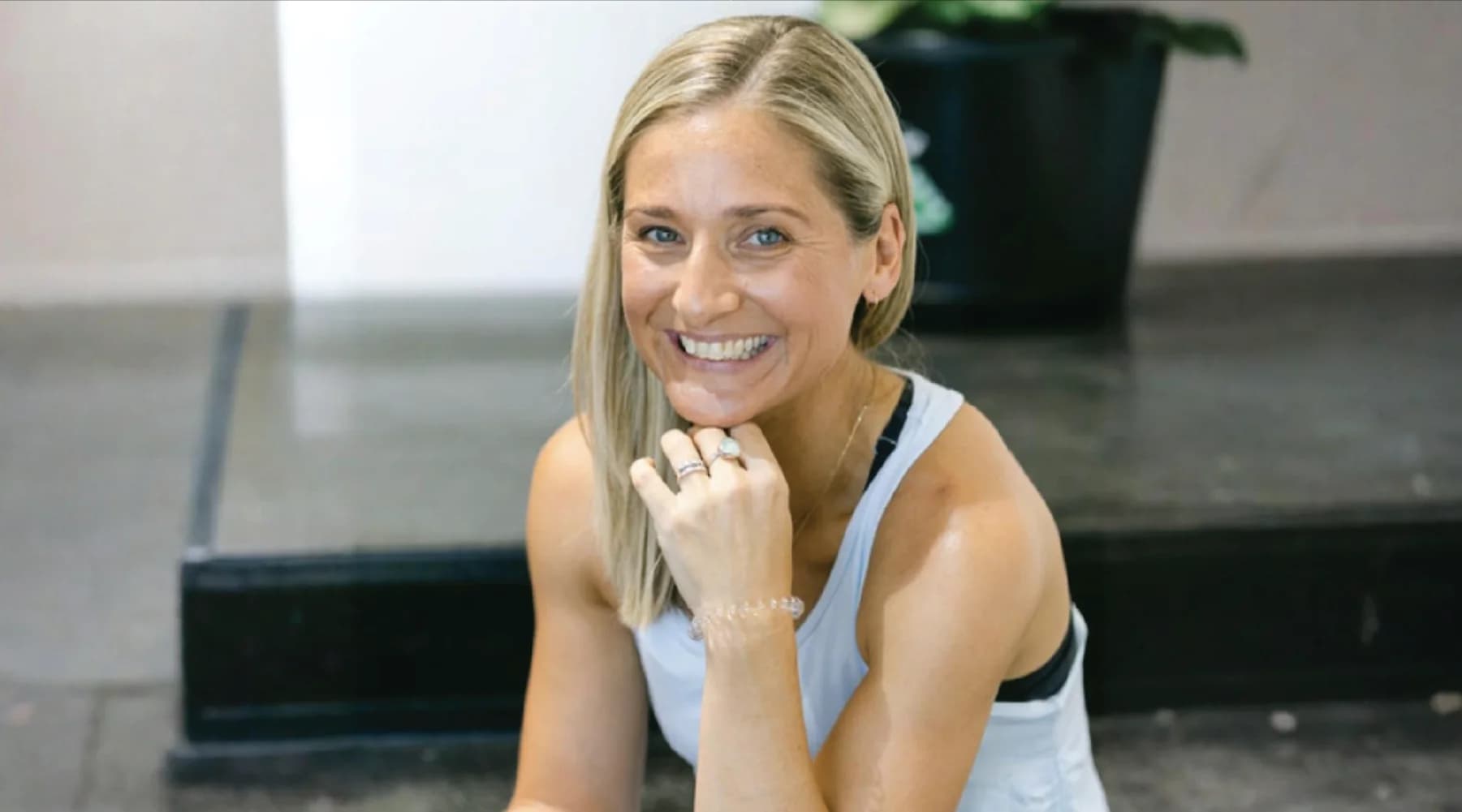 Black-and-white portrait of Kel Wood, Studio Owner behind hotyogaoxenford.com.au & www.hotyogasouthport.com.au