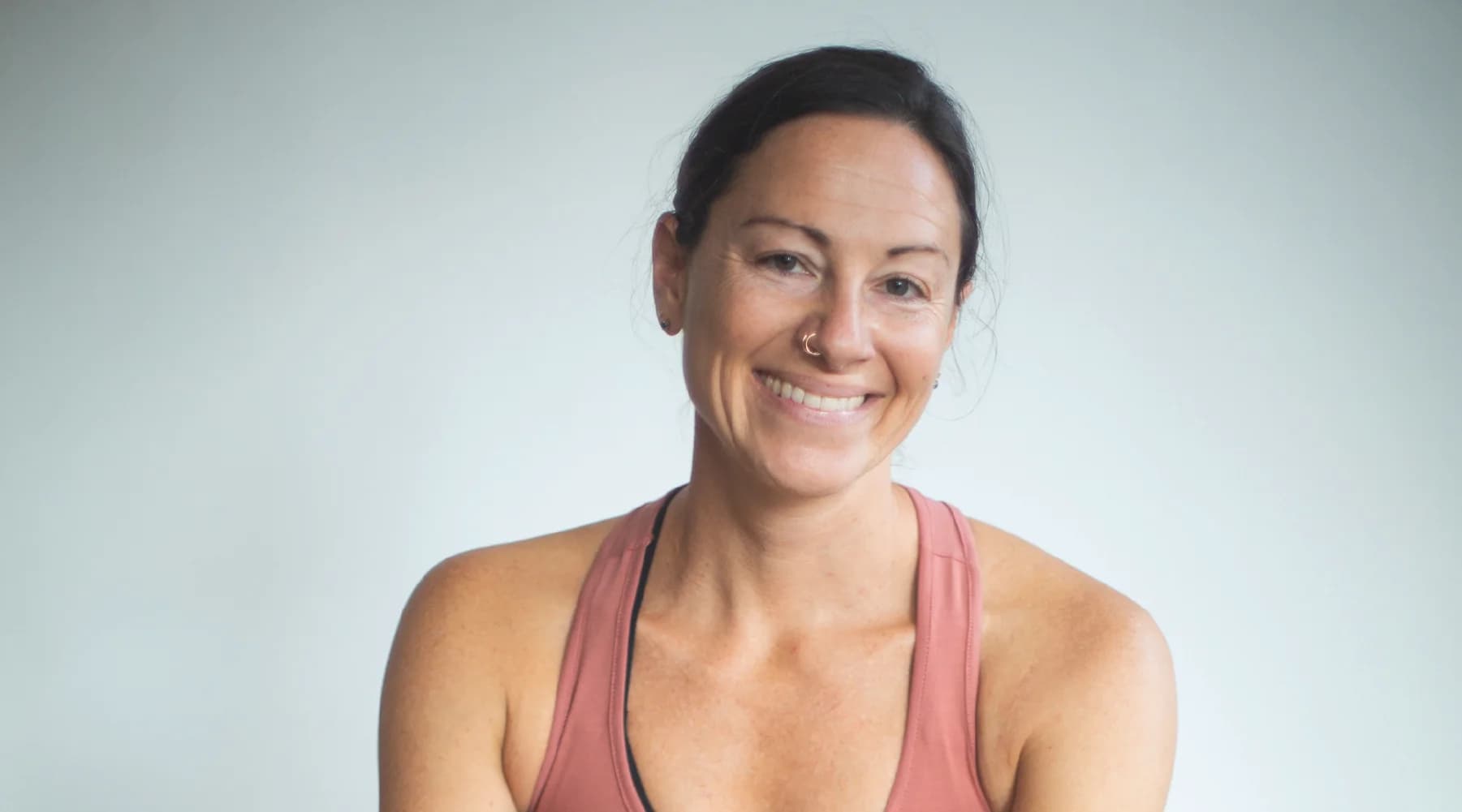 Black-and-white portrait of Ashley Ribaudo, Studio Owner behind saintlouisashtangayoga.com
